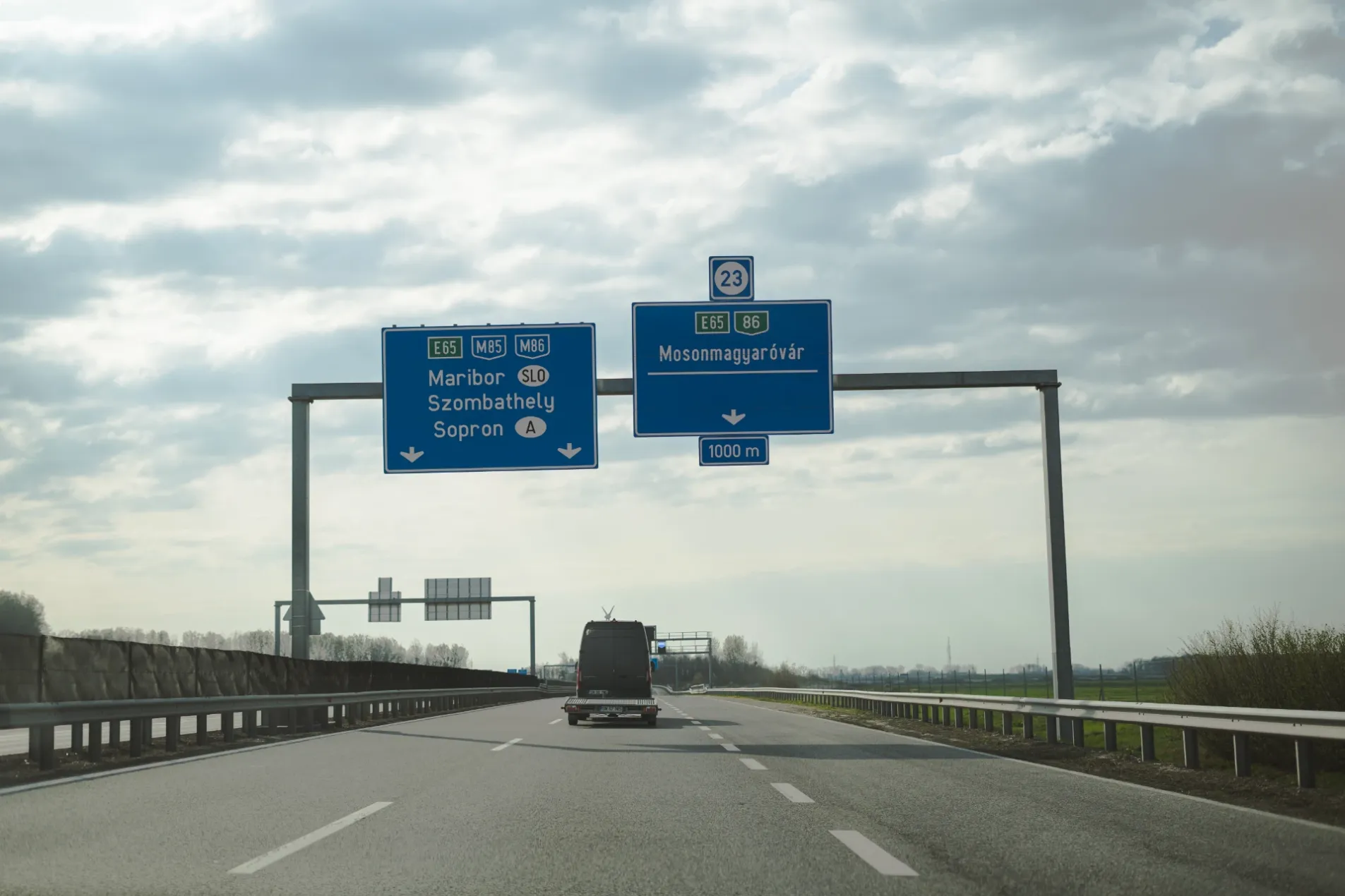 Hungary motorway overhead signs on E65 directing to Maribor Slovenia, Szombathely, Sopron and Mosonmagyaróvár exit 23 at 1000m