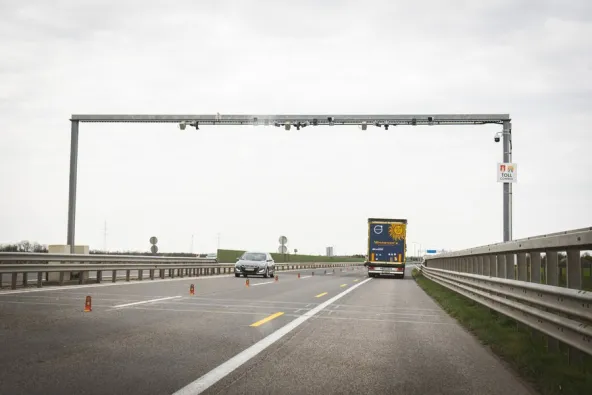 KSZR vignette enforcement gantry on the M1 motorway scanning passing vehicles for a valid Matrica vignette, photographed shortly after the Rajka border crossing into Hungary by Noemi Karacsonyi.